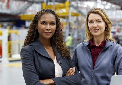 Female professionals in car plant